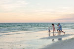 Tiffany Shae | Wedding + Lifestyle Photography family running and playing on the beach at sunset on 30A beaches